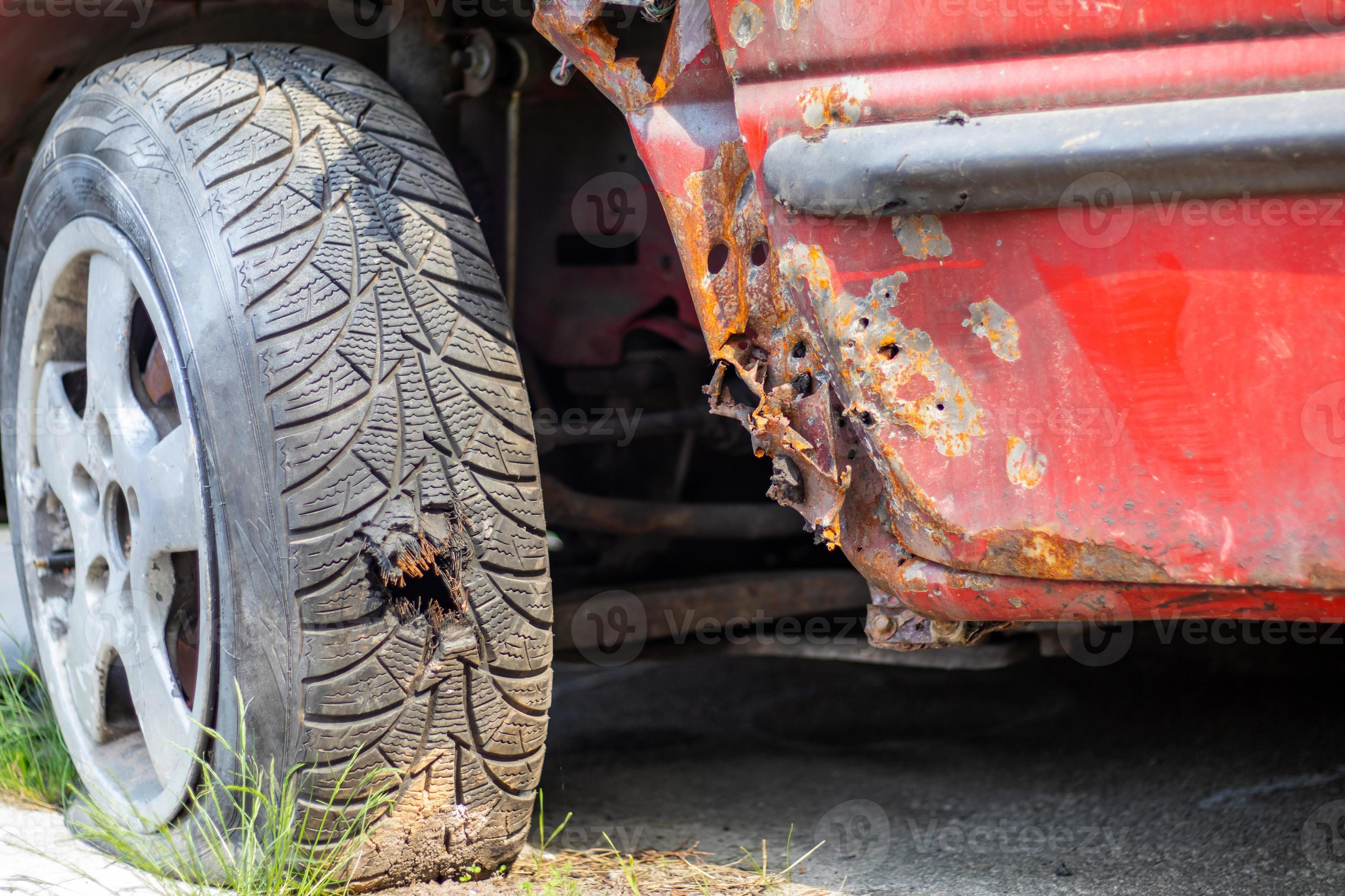 Flat car tire closeup. Shot through the wheel by the police while