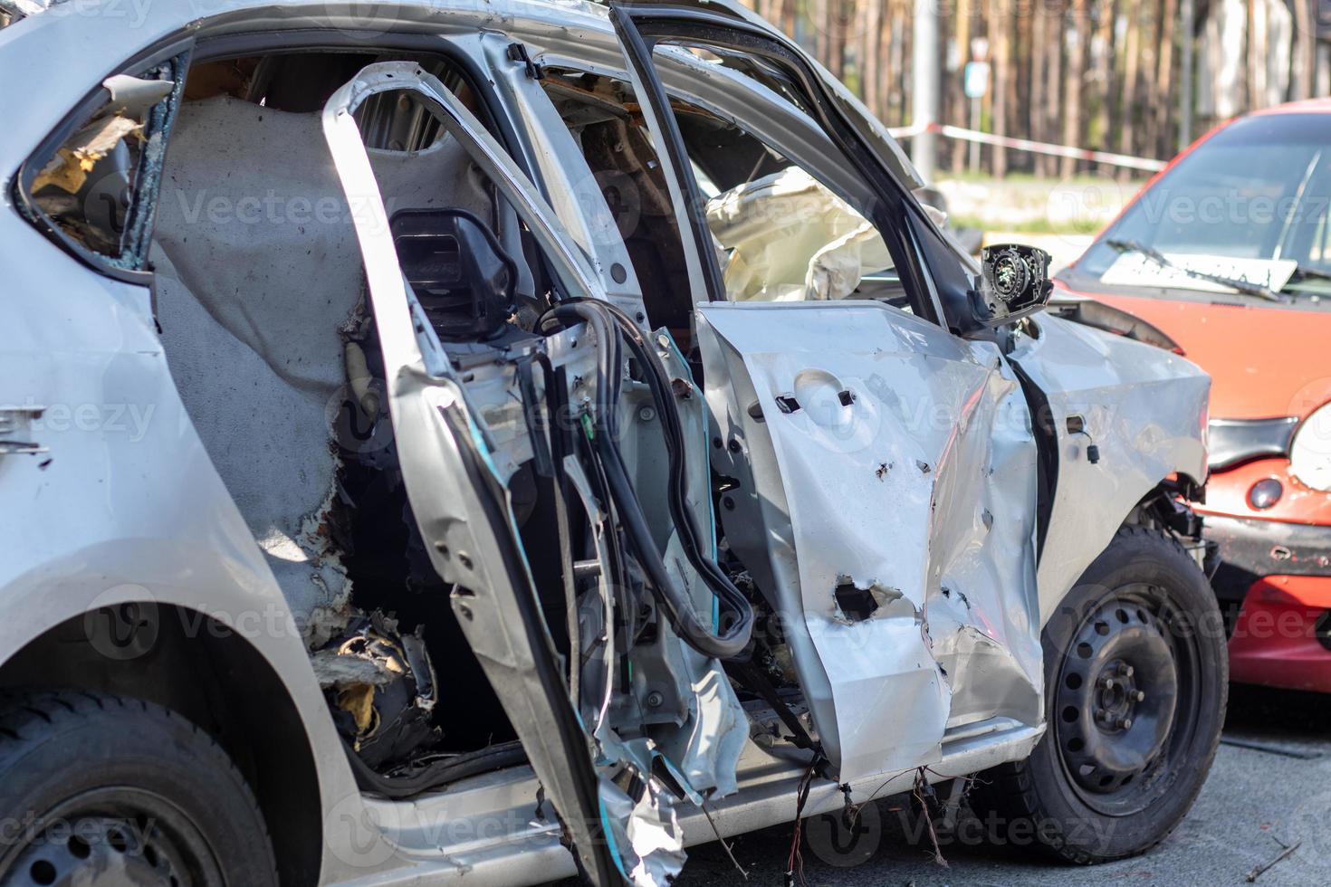 Traffic accident on the street, damaged car after a collision in the city. Accident due to speeding and alcohol intoxication. Transport background. The concept of road safety and insurance. photo