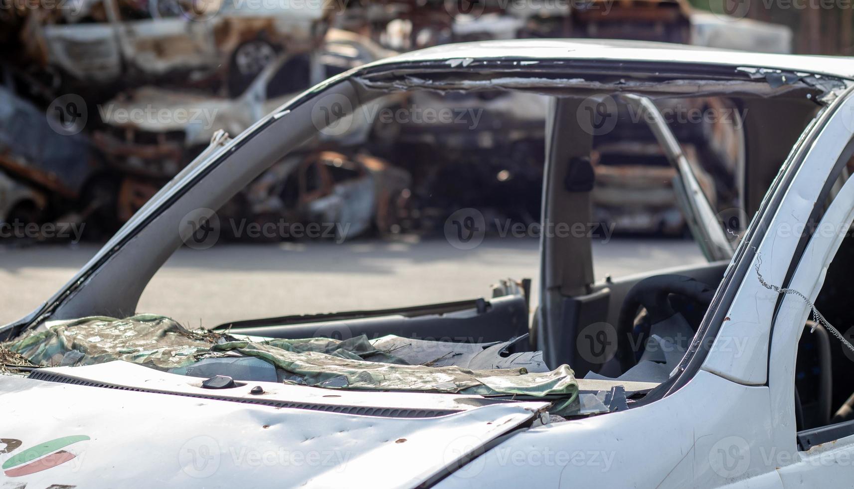 A car after an accident with a broken rear window. Broken window in a vehicle. The wreckage of the interior of a modern car after an accident, a detailed close-up view of the damaged car. photo
