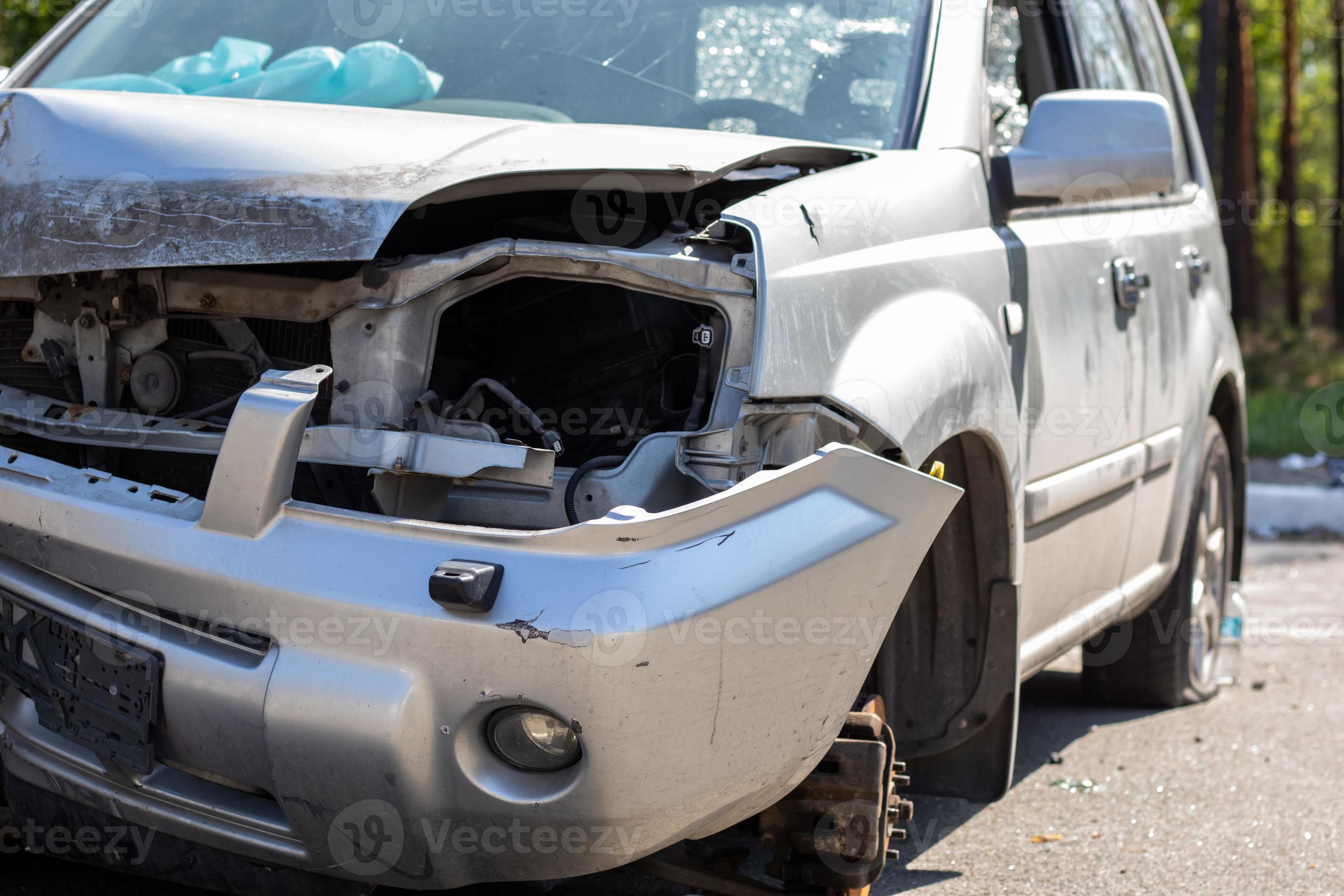 Broken Car after a Crash. Damaged Wing and Headlamp of a Car