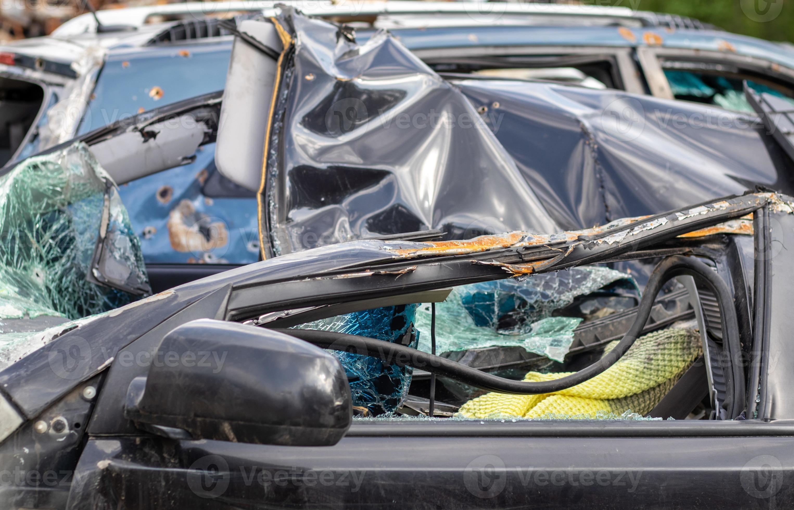 Many broken cars after a traffic accident in the parking lot of a  restoration service station on the street. Car body damage workshop  outdoors. Sale of insurance emergency vehicles at auction. 8280684