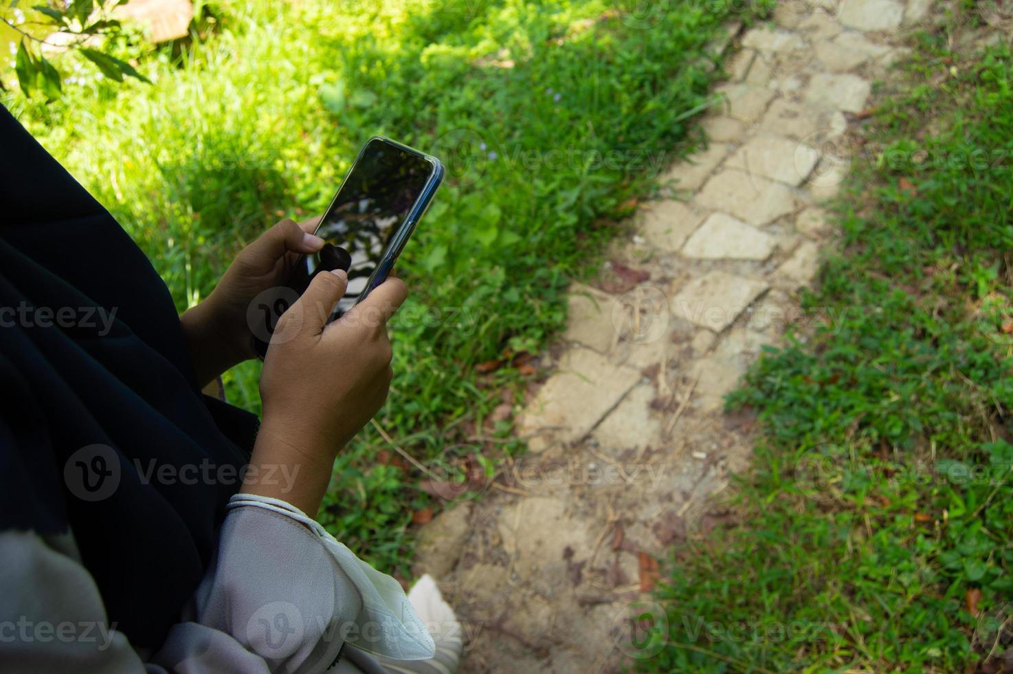 selective focus of someone who is holding a cellphone photo