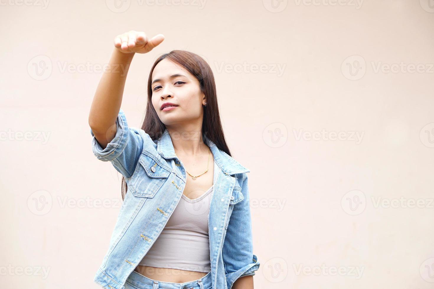 woman waved her hand, calling for him to come in. photo