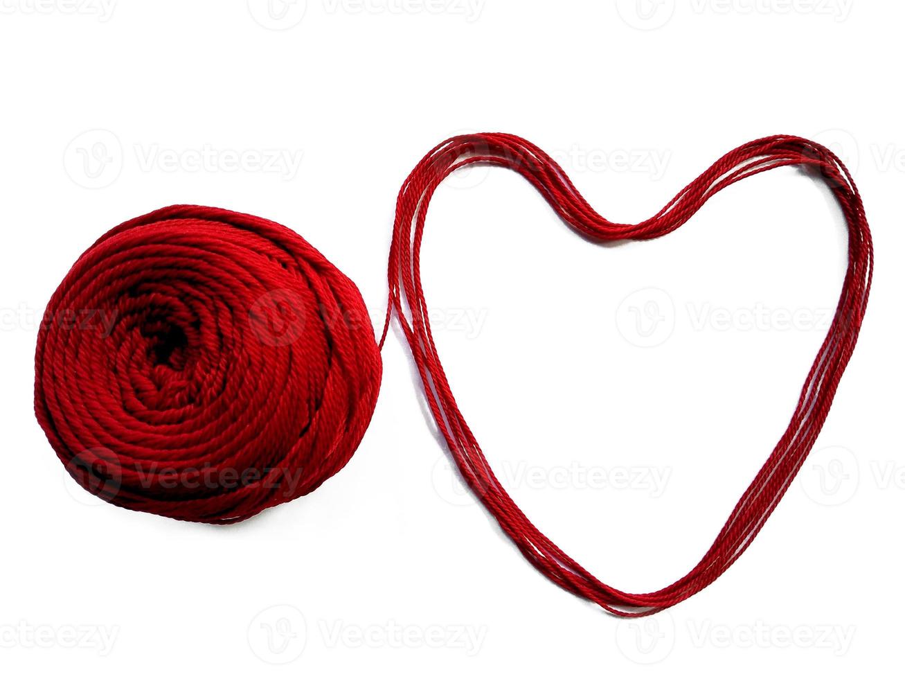 Knitting yarn heart shaped isolated on white background photo
