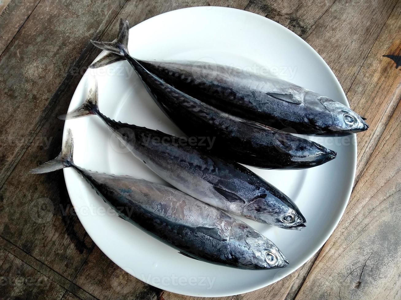 Fresh fish on a plate. Traditional Indonesian culinary food photo