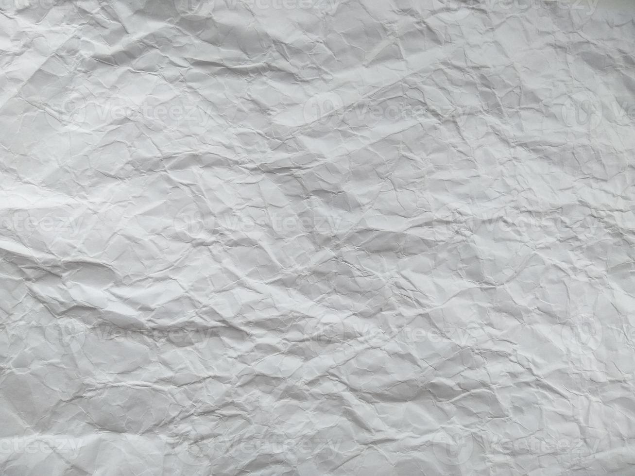 Crumpled paper texture isolated on white background photo