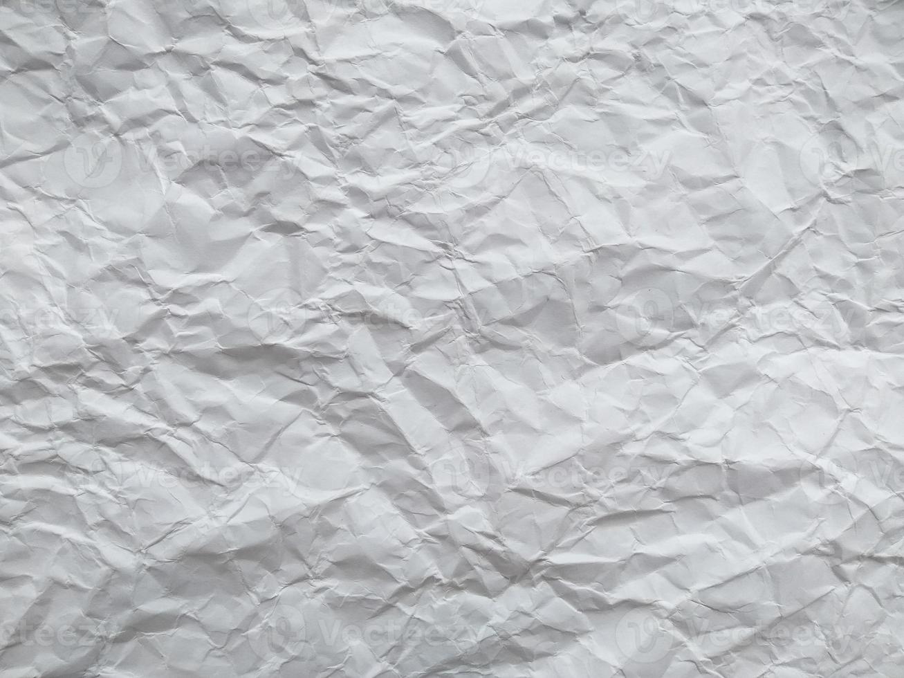 Crumpled paper texture isolated on white background photo