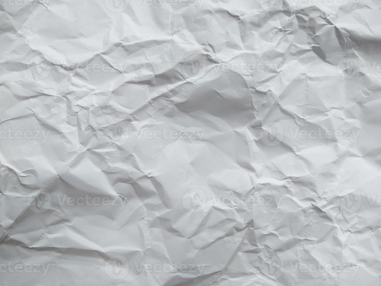 Crumpled paper texture isolated on white background photo