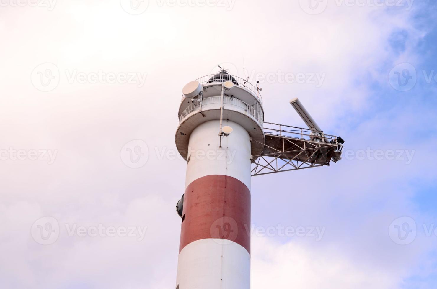 Red and White Lighthouse photo