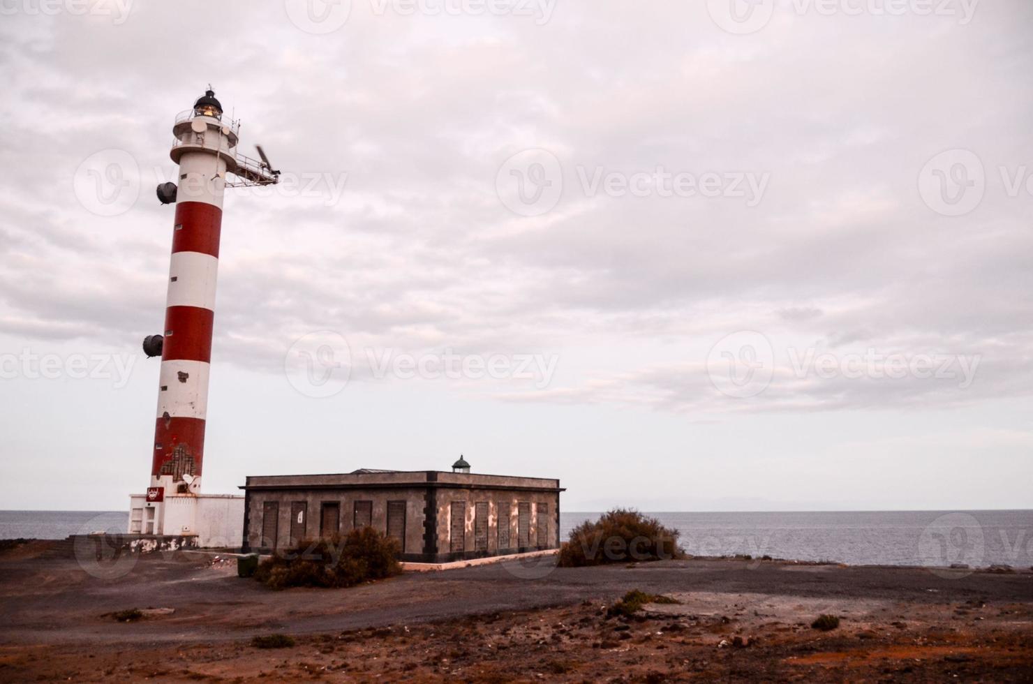 Red and White Lighthouse photo