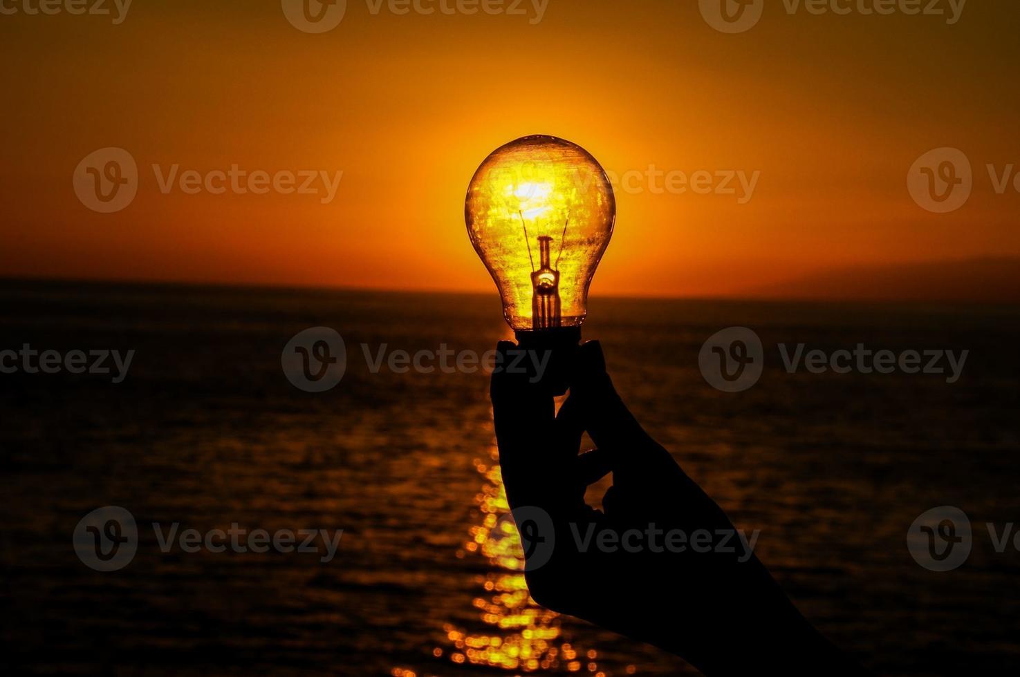 Sunset through a lightbulb photo