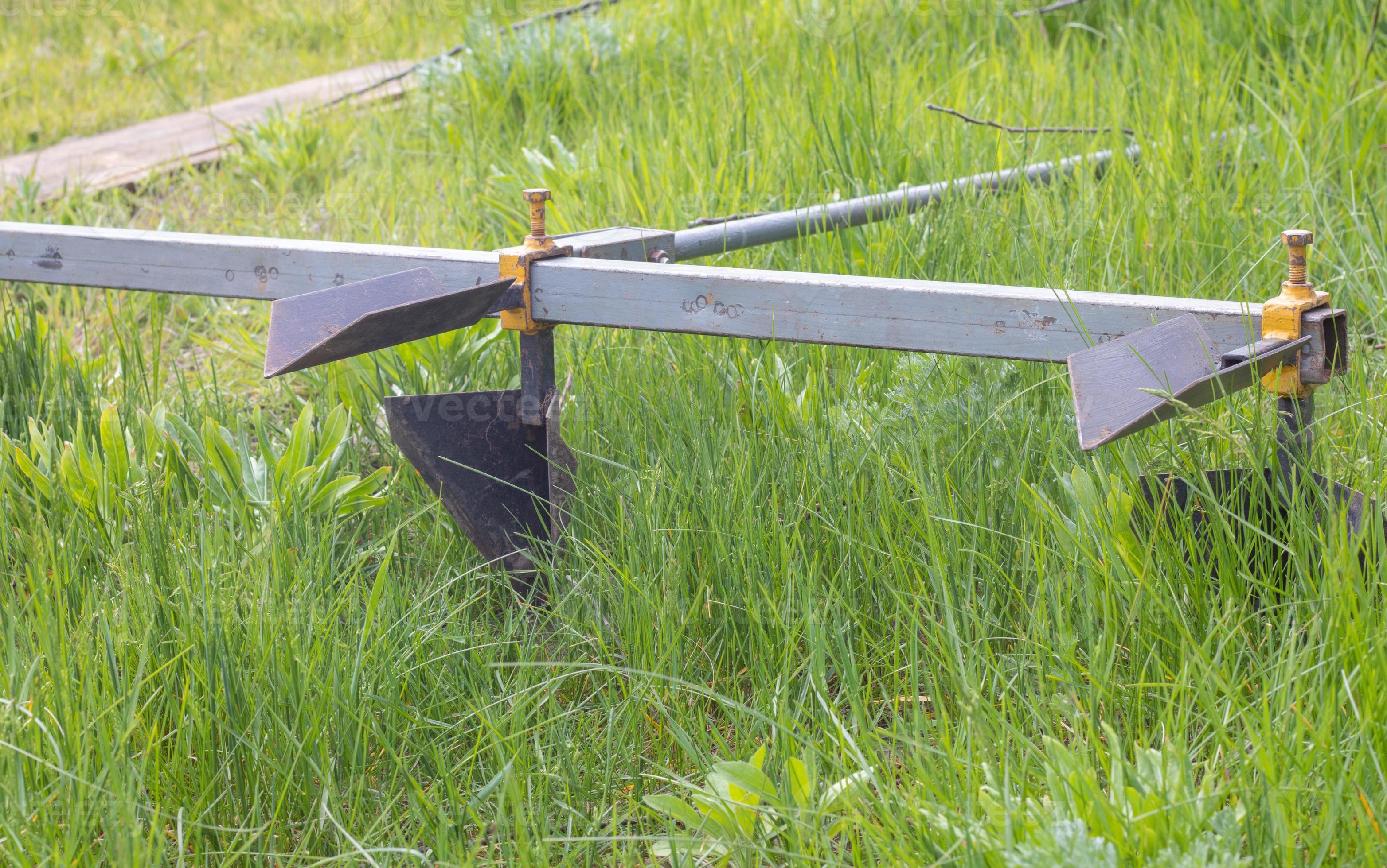 Agricultural manual metal plow on the field. Plowing the land before
