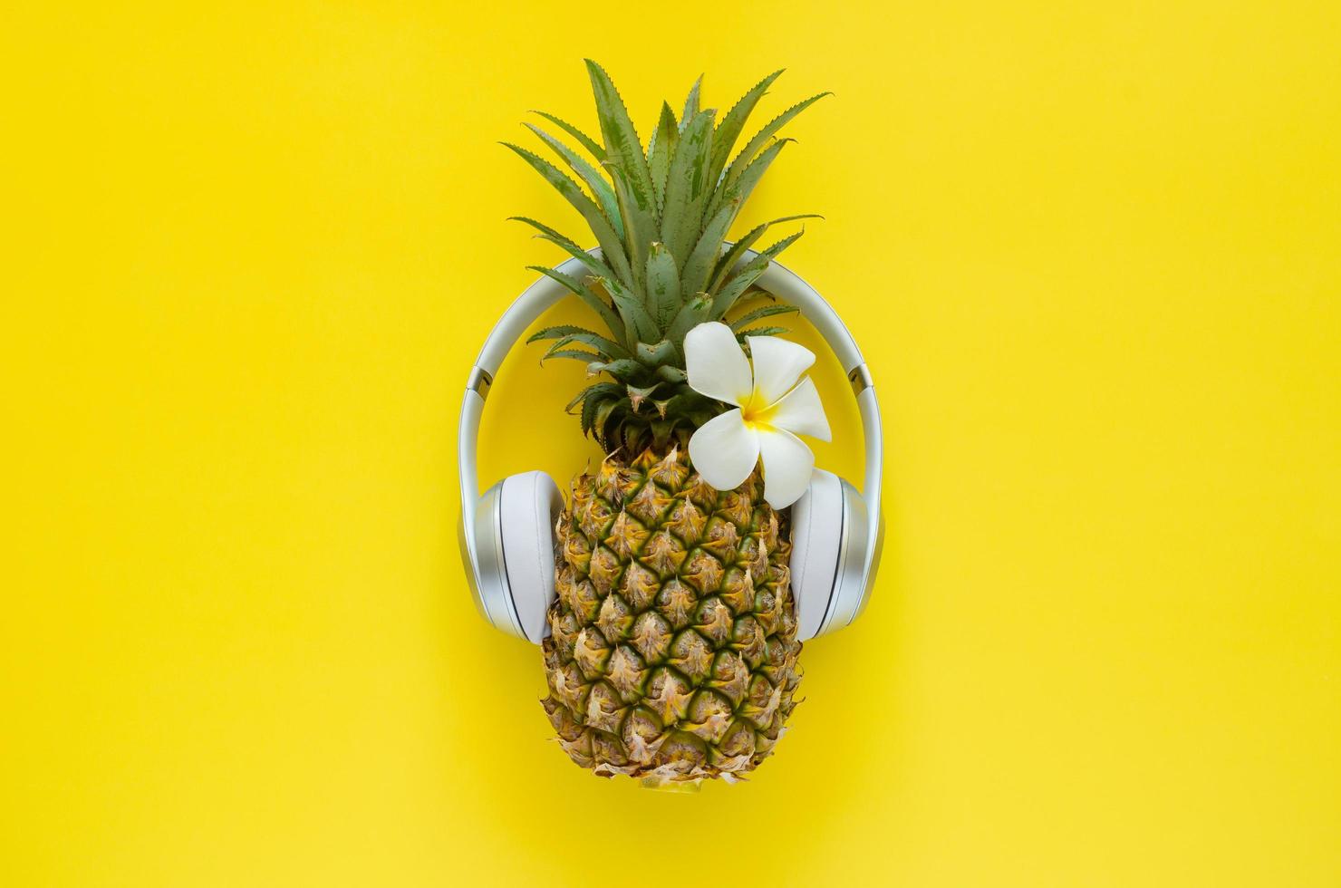 Pineapple wearing wireless headphone photo