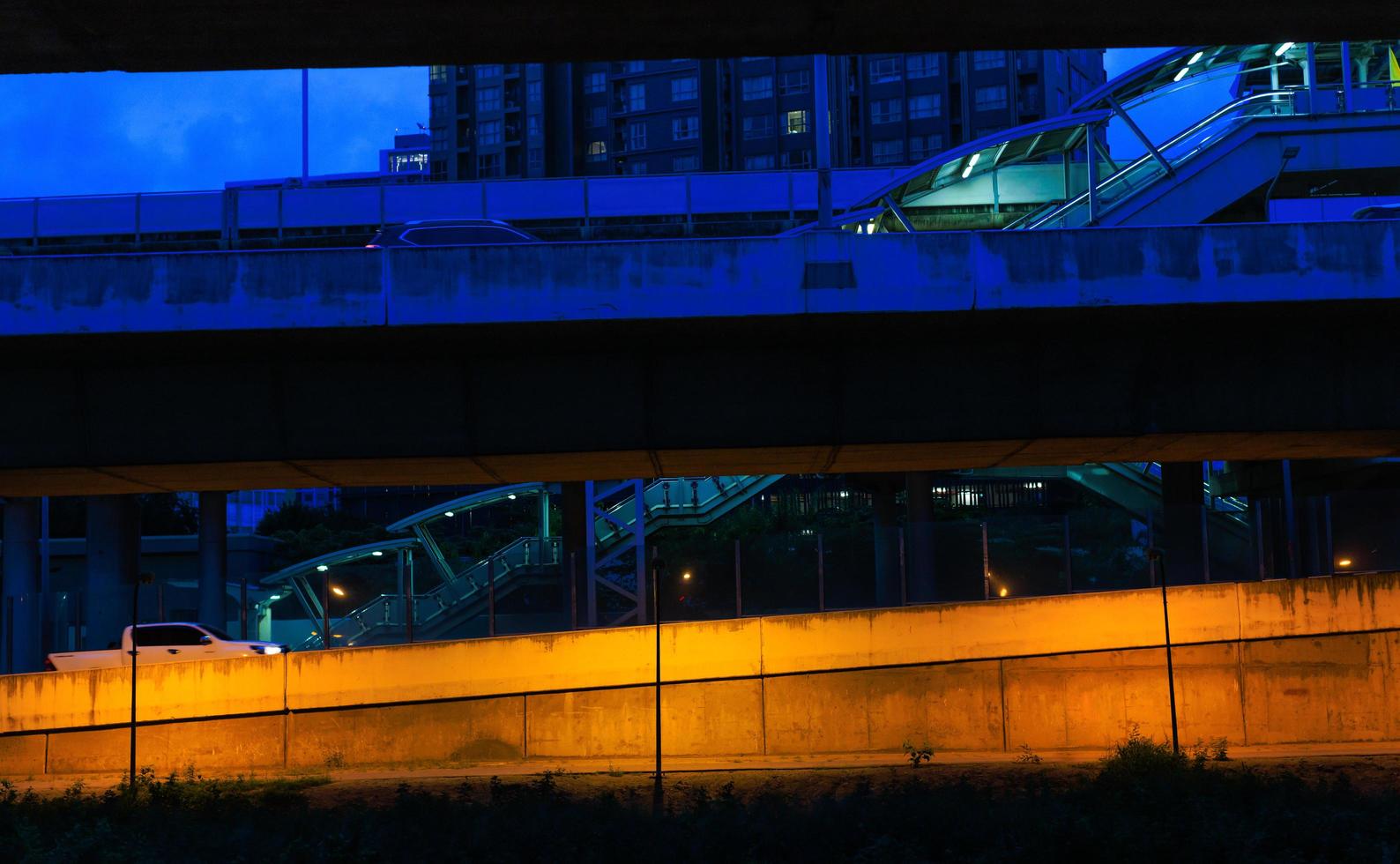 Road, pavement and staircase in city at twilight. Combination of multi transportation ways in town photo