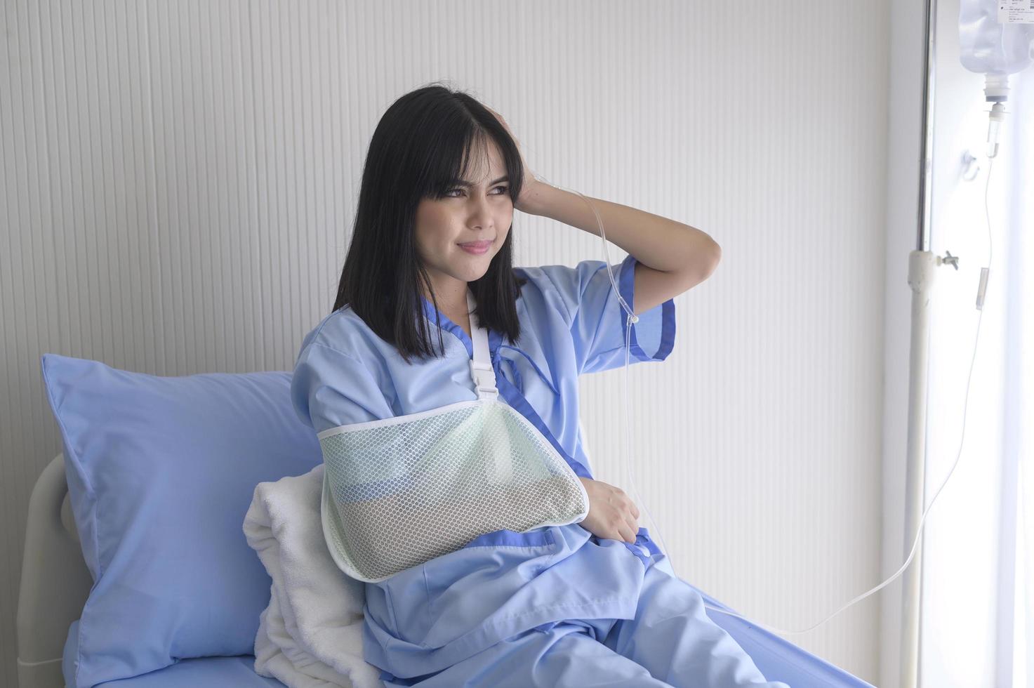 A despondent Asian woman patient. Following the doctor's declaration that the cancer was nearing the end of its course. photo