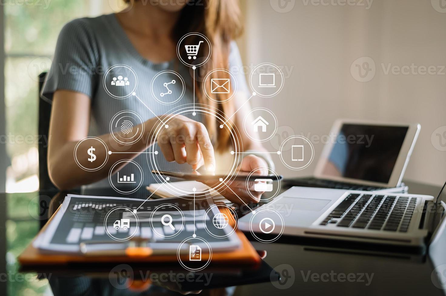 Businessman working with smart phone and laptop and digital tablet computer in  office with digital marketing media  in virtual icon photo