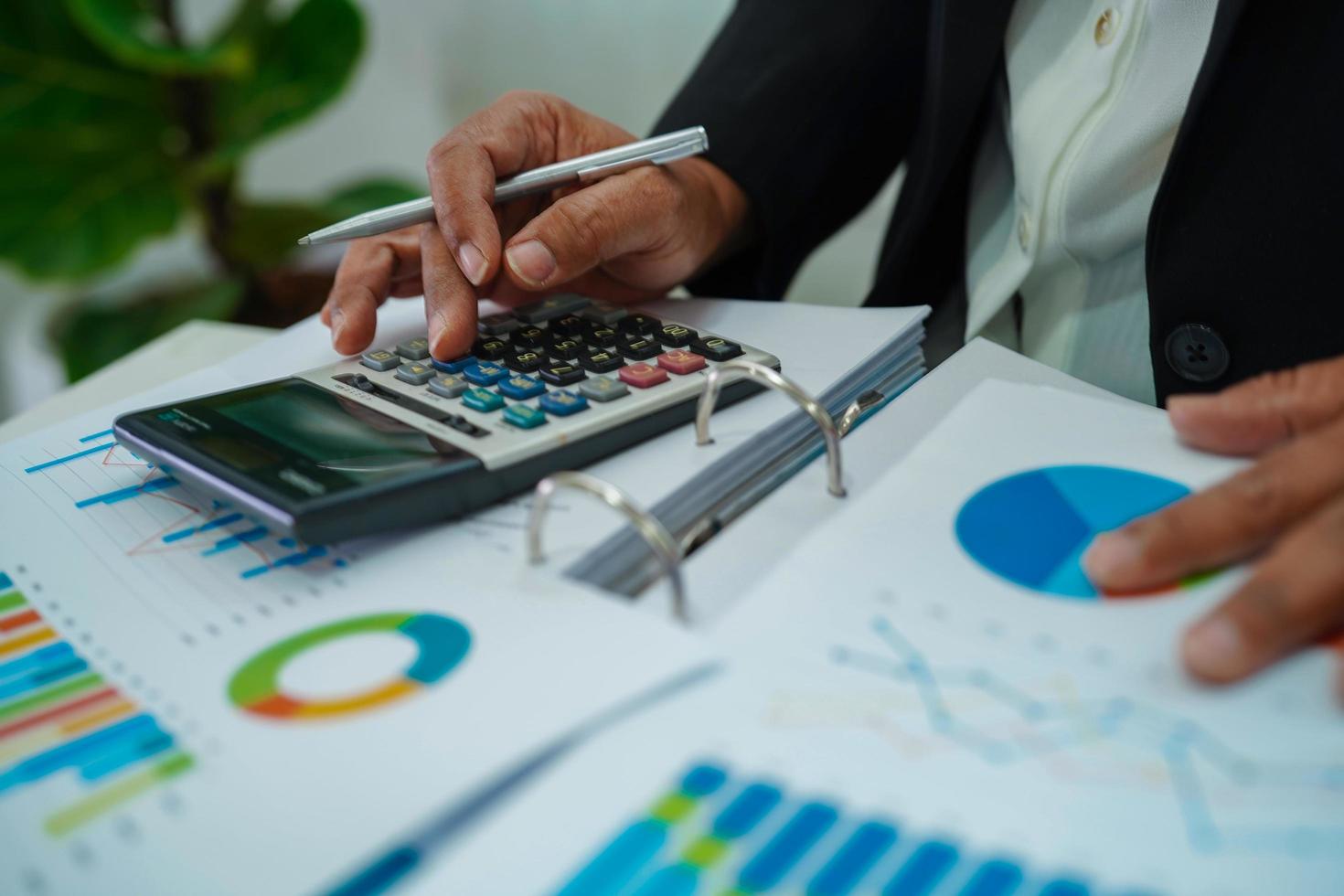 Businessman working and analysis with statistic graph in office. photo