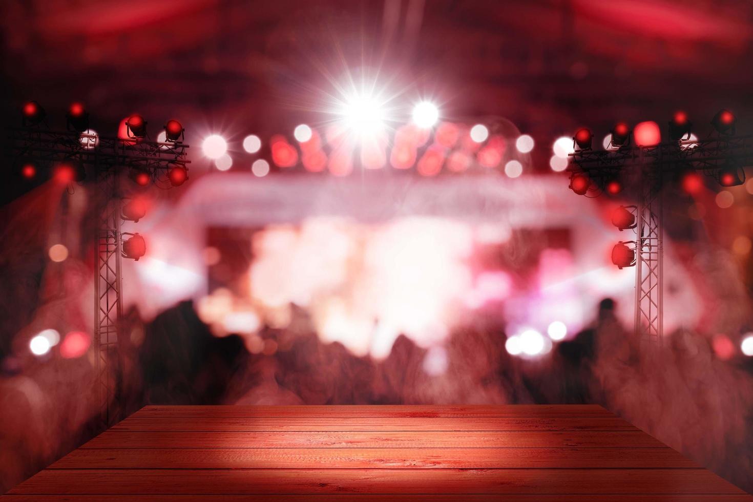 blurred concert red lighting and bokeh on stage with wooden floor photo