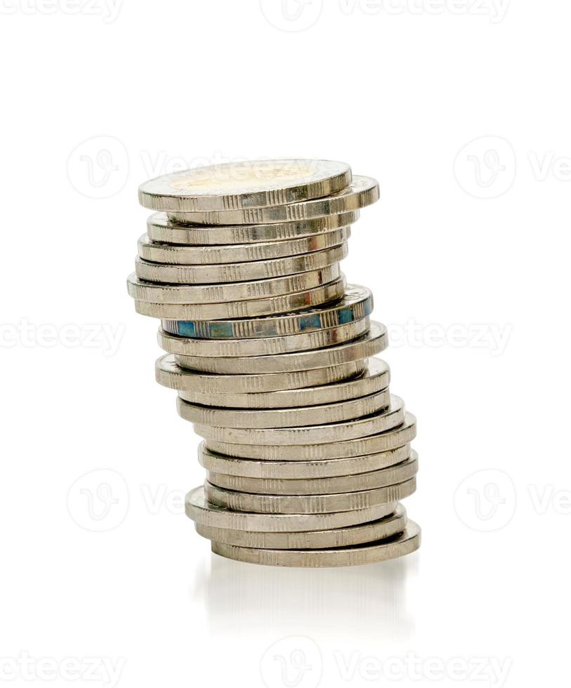 closeup silver coins stacks isolated on white background photo