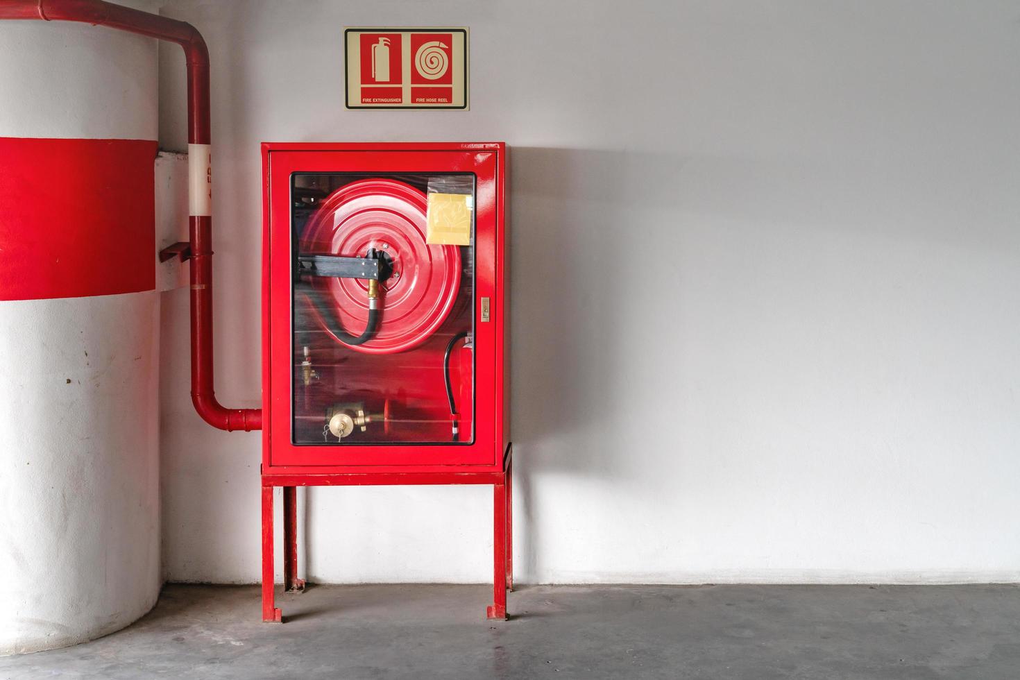 fire extinguish equipment with white wall photo
