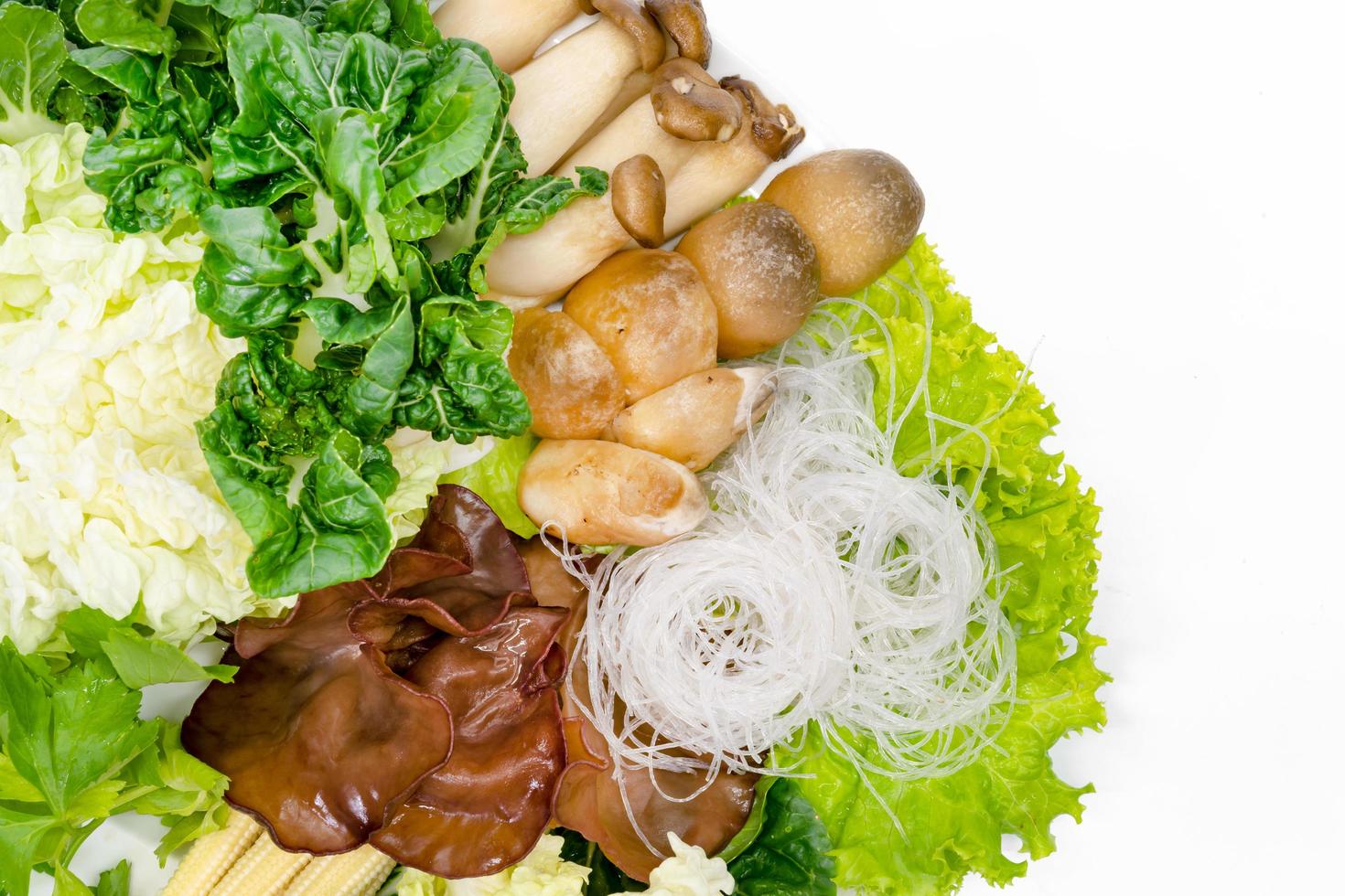 various fresh vegetables for sukiyaki on white background photo