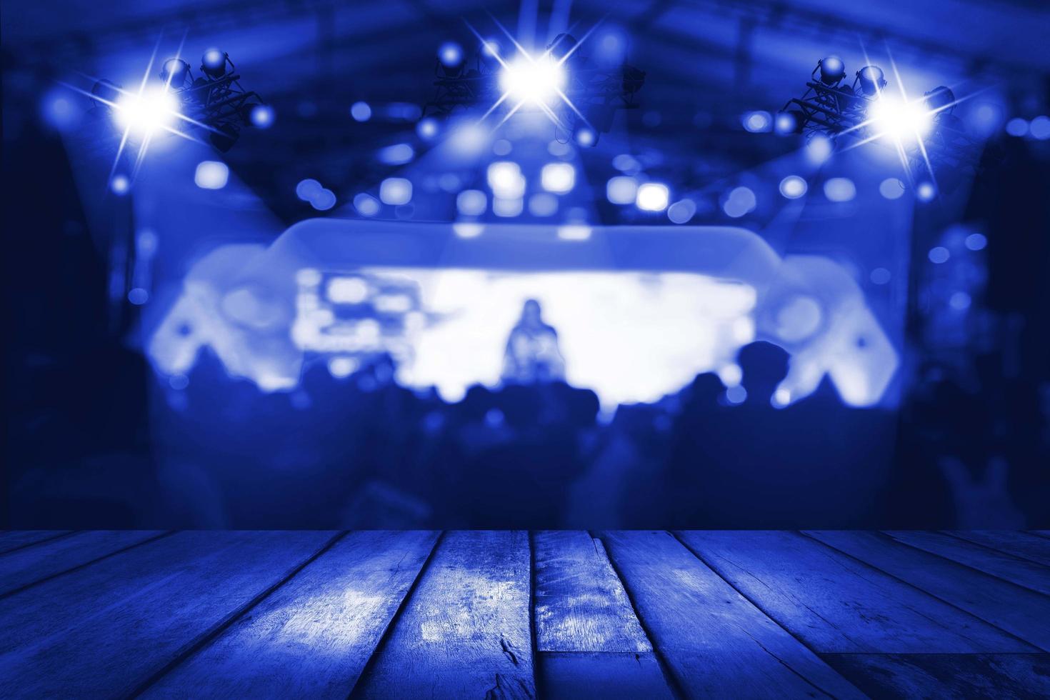 blurred concert lighting and bokeh on stage with wooden floor photo