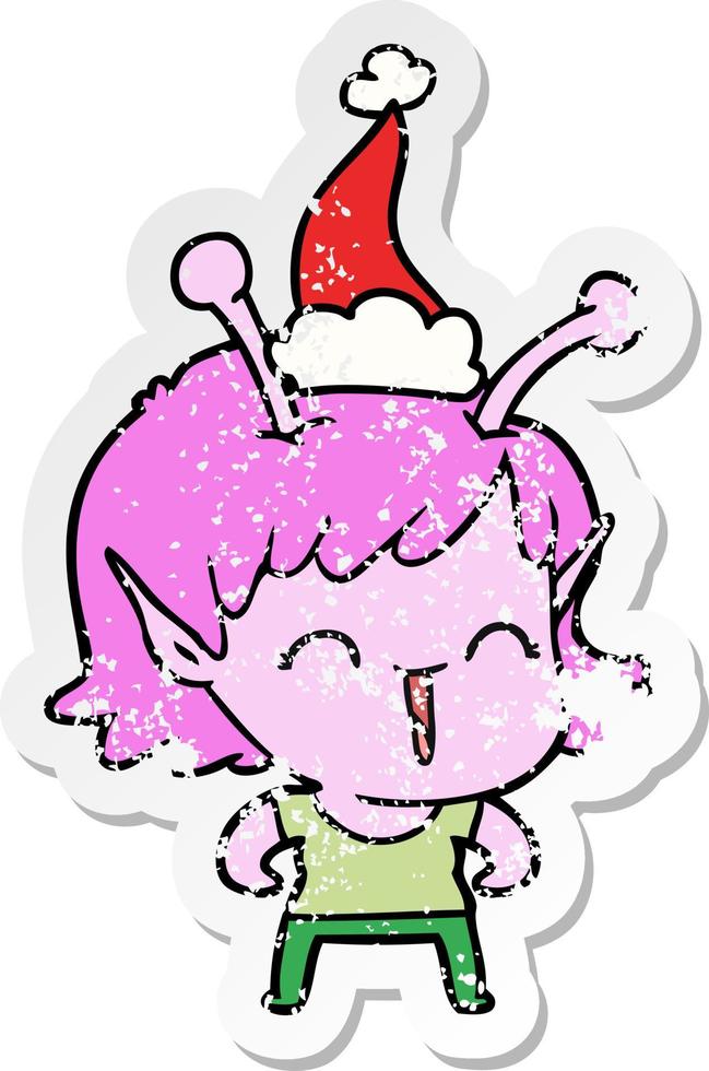 distressed sticker cartoon of a alien girl laughing wearing santa hat vector