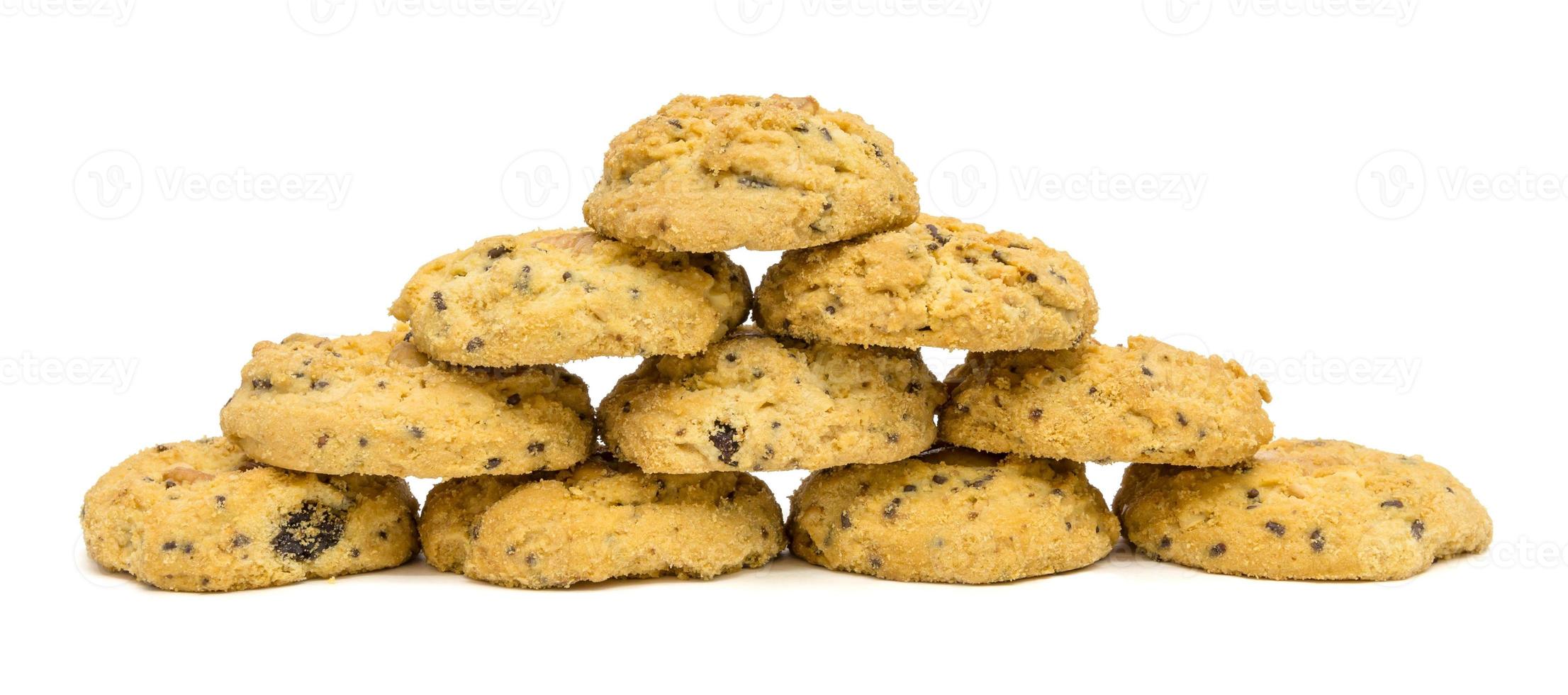 butter cookies with cashew nuts forming pyramid at eye level. isolated on white background photo