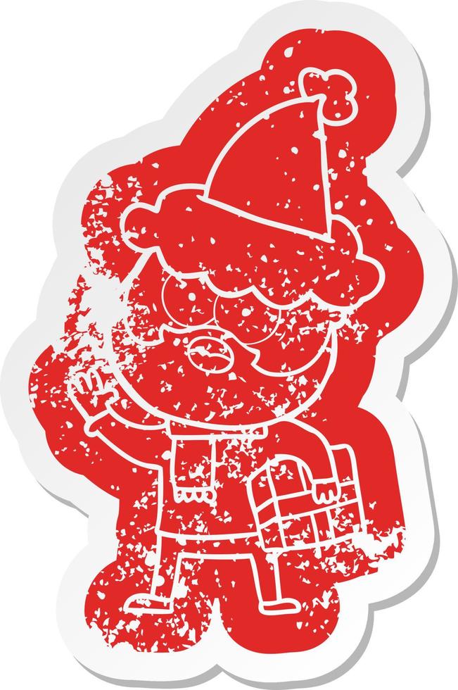 cartoon distressed sticker of a bearded man with present wearing santa hat vector