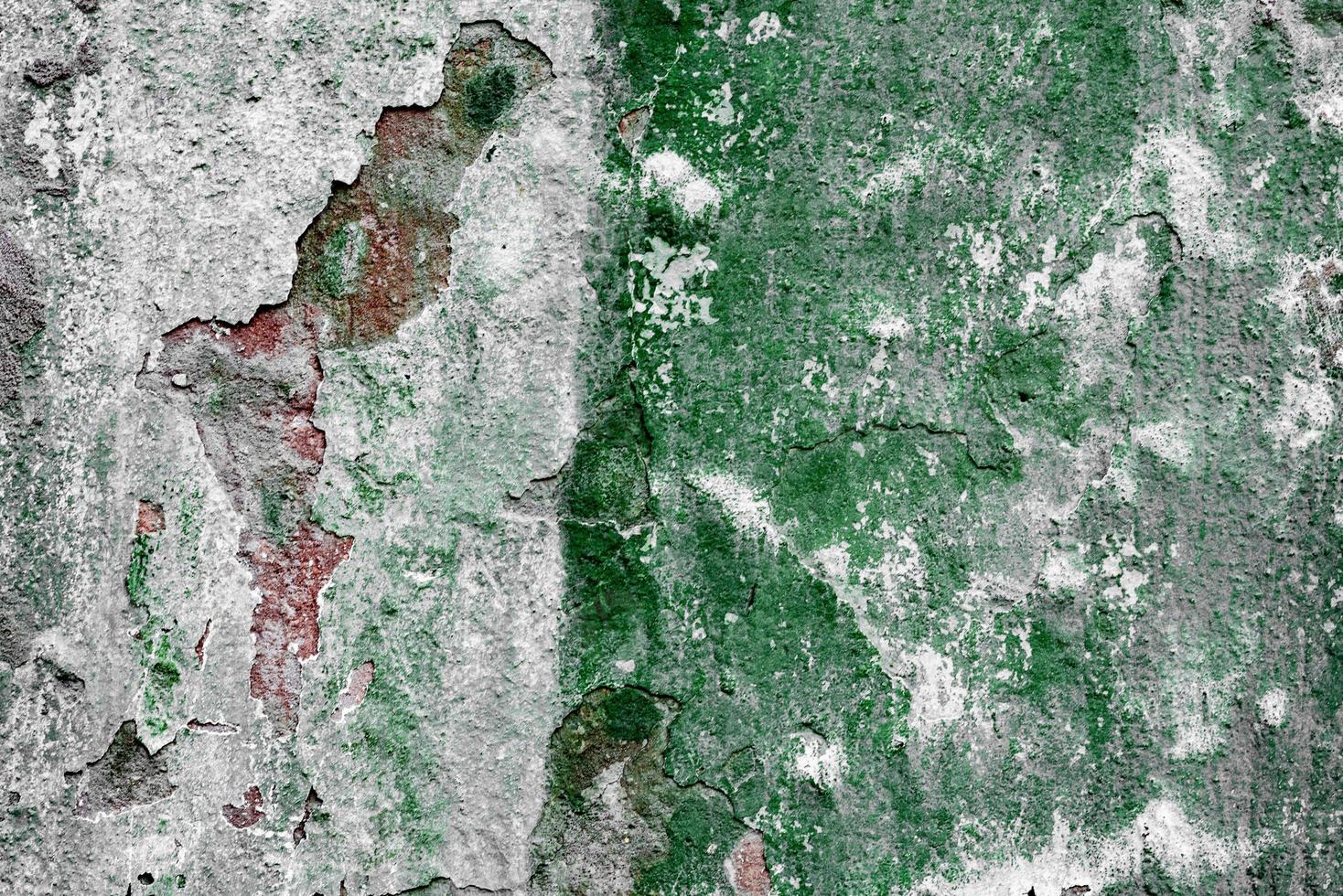 Texture of a concrete wall with cracks and scratches which can be used as a background photo