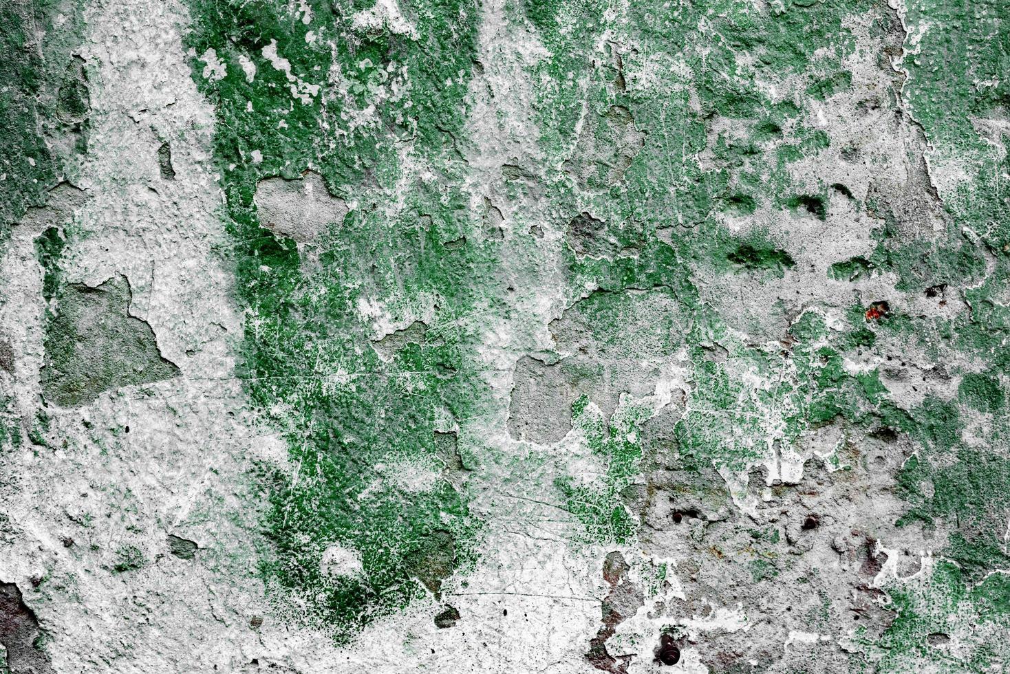 Texture of a concrete wall with cracks and scratches which can be used as a background photo