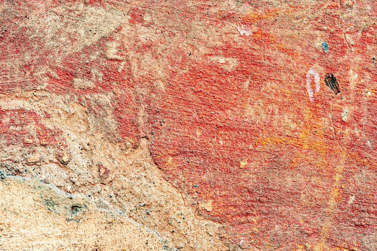 Texture of a concrete wall with cracks and scratches which can be used as a background photo