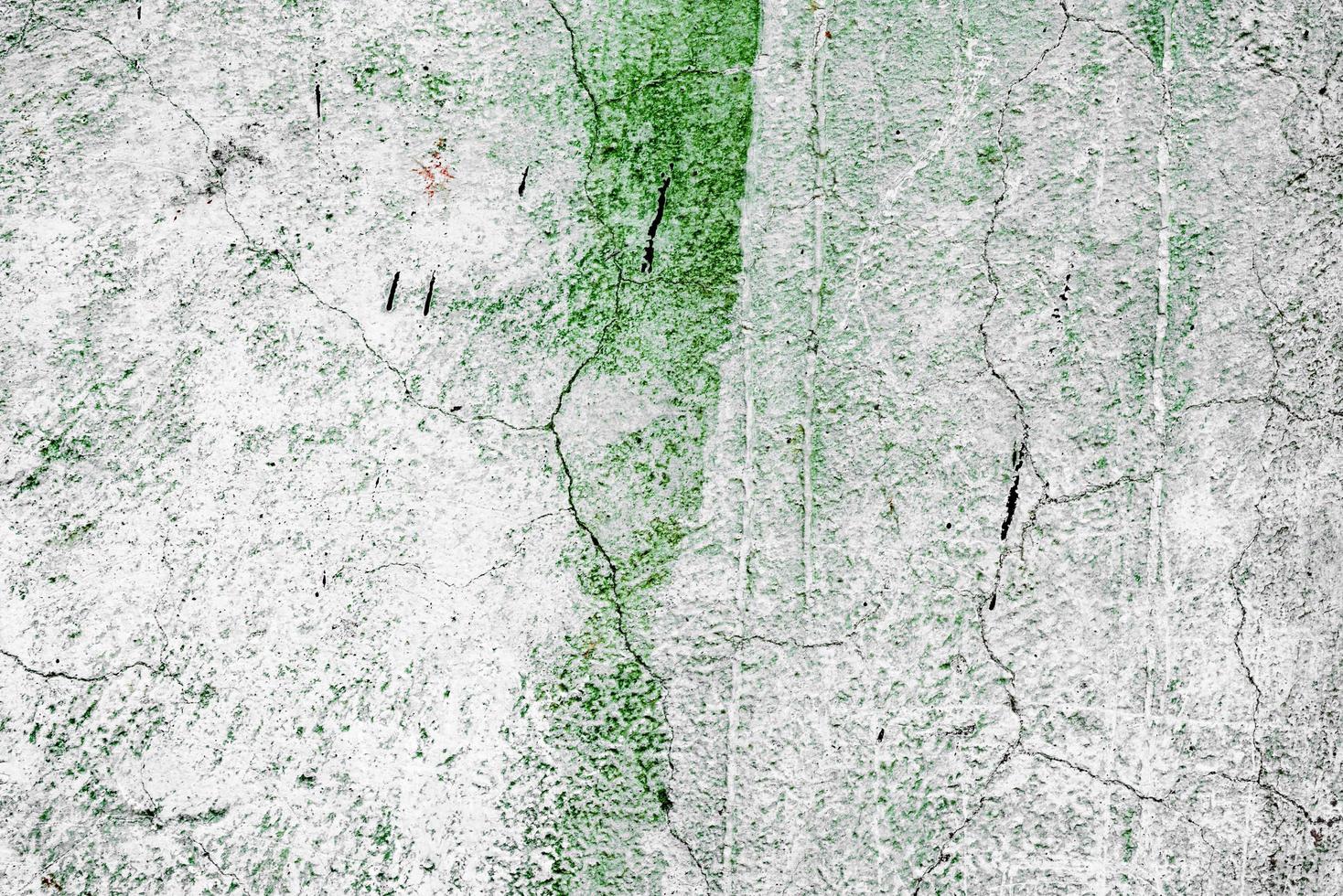 Texture of a concrete wall with cracks and scratches which can be used as a background photo