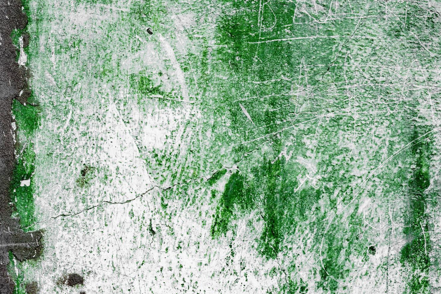 Texture of a concrete wall with cracks and scratches which can be used as a background photo