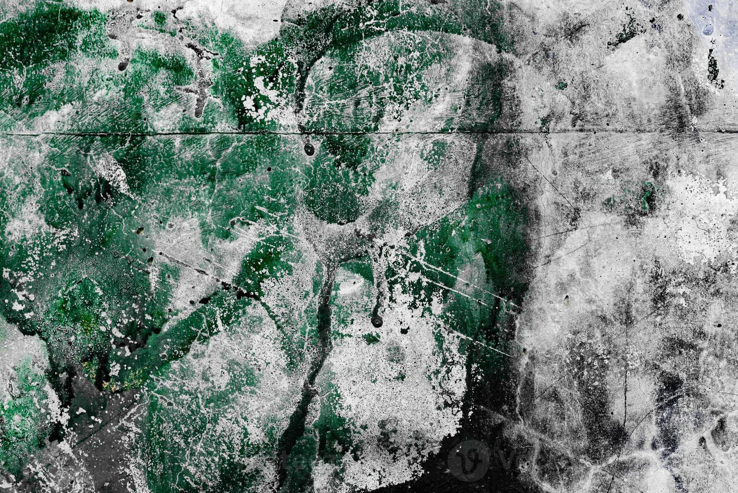 Texture of a concrete wall with cracks and scratches which can be used as a background photo