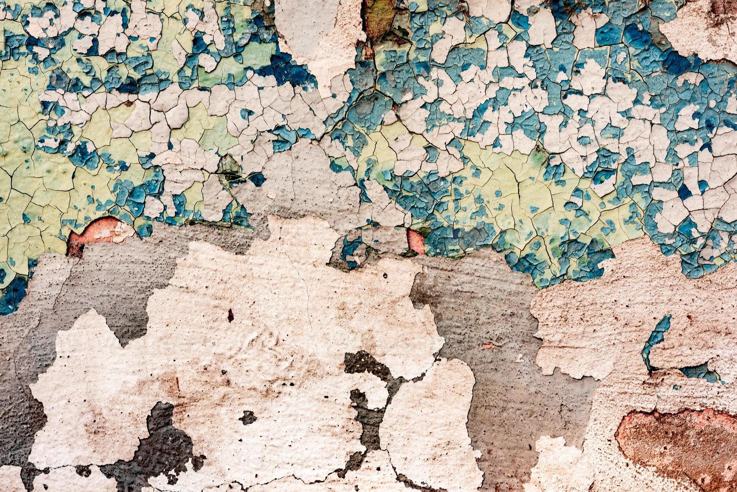 Texture of a concrete wall with cracks and scratches which can be used as a background photo