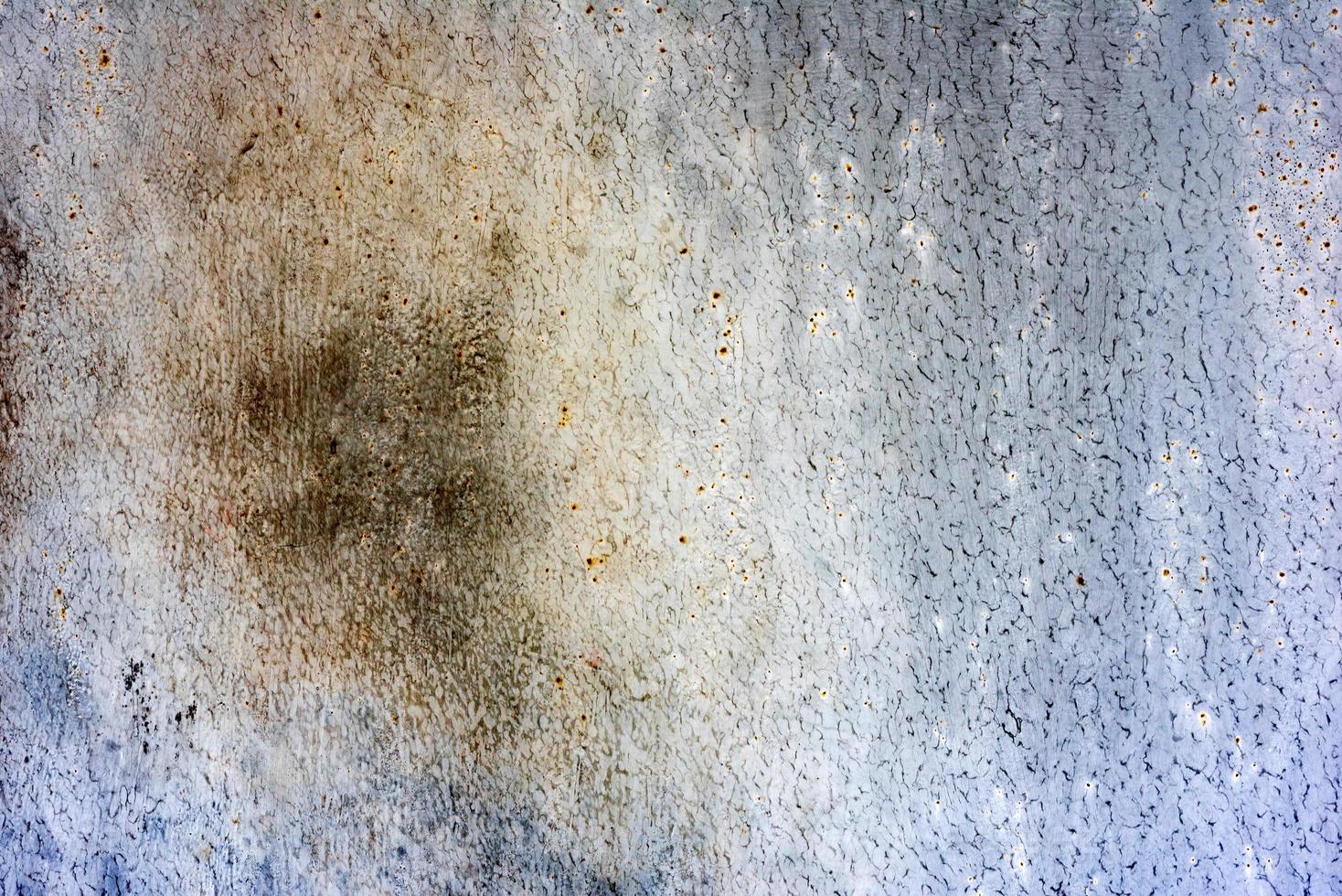 Metal texture with scratches and cracks which can be used as a background photo