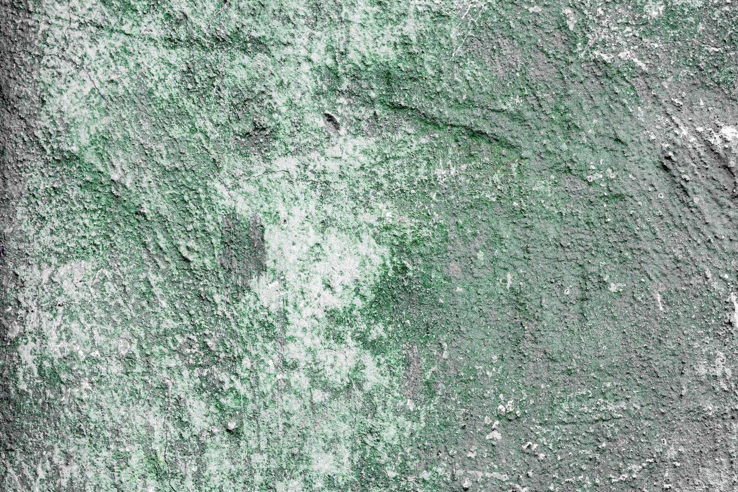 Texture of a concrete wall with cracks and scratches which can be used as a background photo
