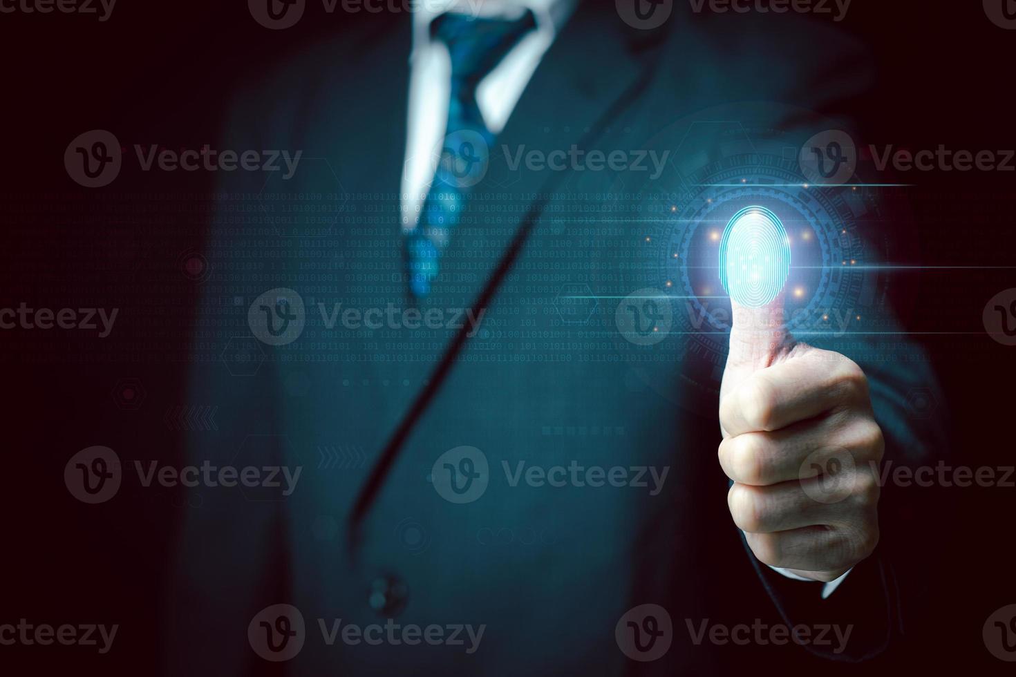 Businessman scans his fingerprint to access personal financial data. Futuristic business technology security concept. Innovation technology against digital cybercrime. Biometrics identity. photo