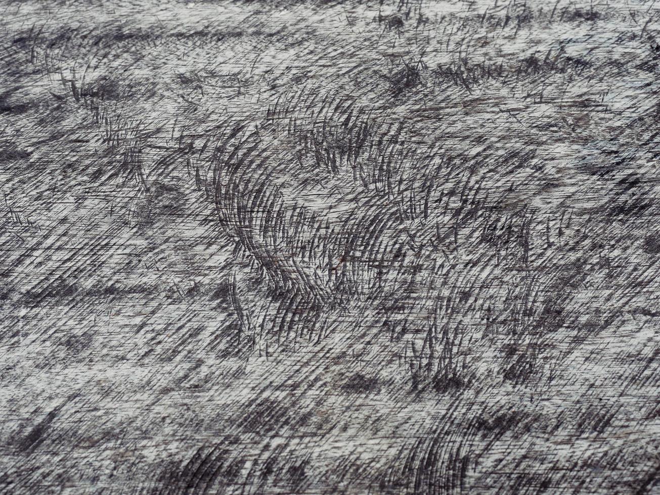 An old wooden plank table with a mottled surface and a pattern. photo