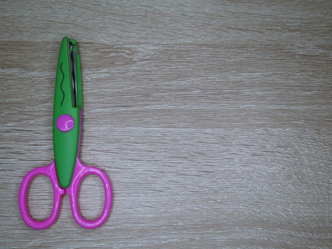 Children's wavy-patterned paper scissors to use in various inventions. photo