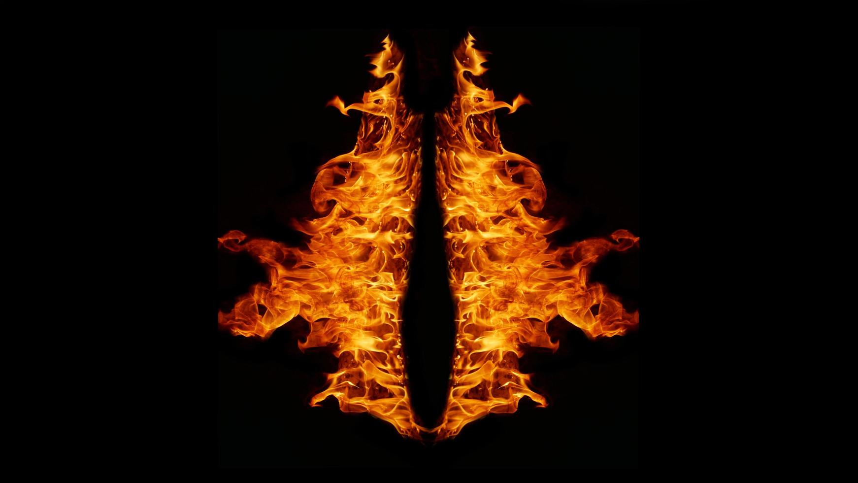 Flame Flame Texture For Strange Shape Fire Background Flame meat that is burned from the stove or from cooking. danger feeling abstract black background Suitable for banners or advertisements. photo