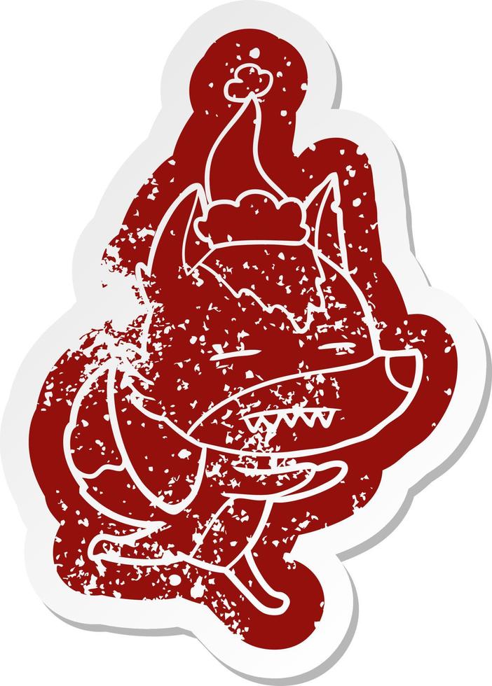 cartoon distressed sticker of a wolf showing teeth wearing santa hat vector