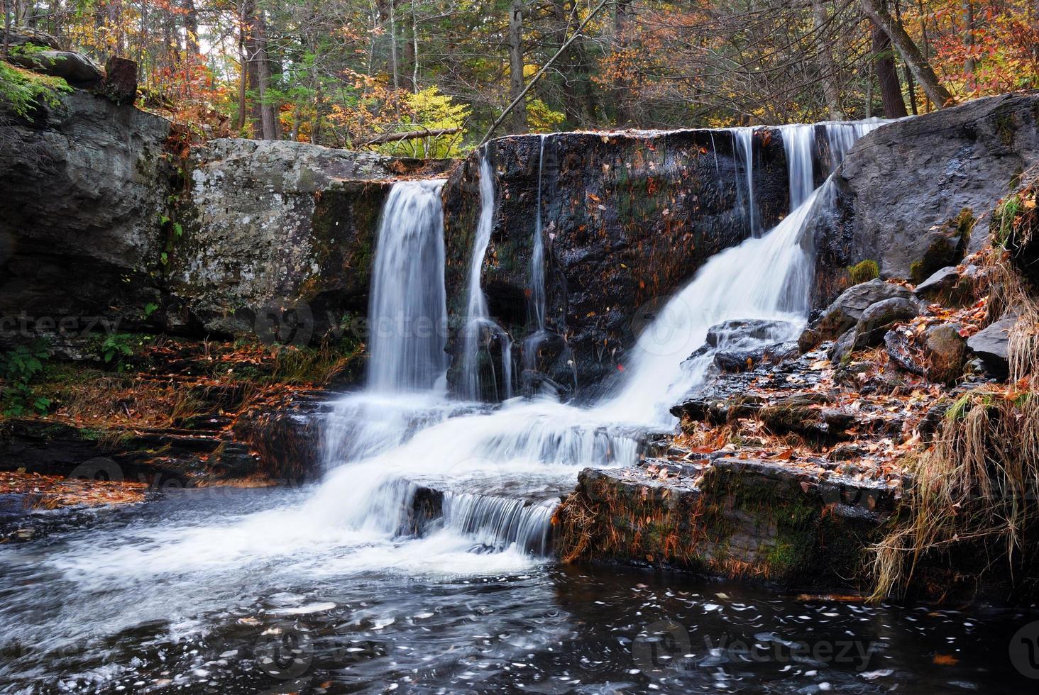 Autumn Waterfall in mountain photo