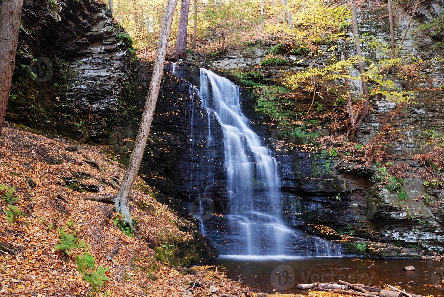 Autumn Waterfall in mountain. photo