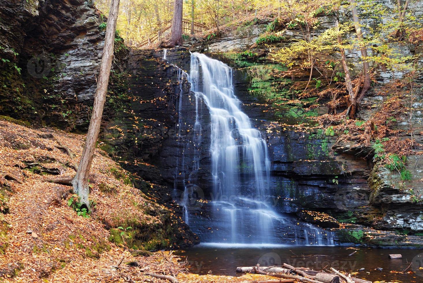 Autumn Waterfall in mountain. photo