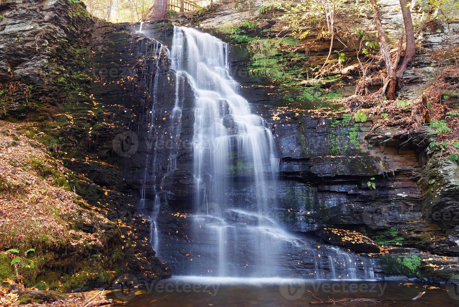 Autumn Waterfall in mountain. photo