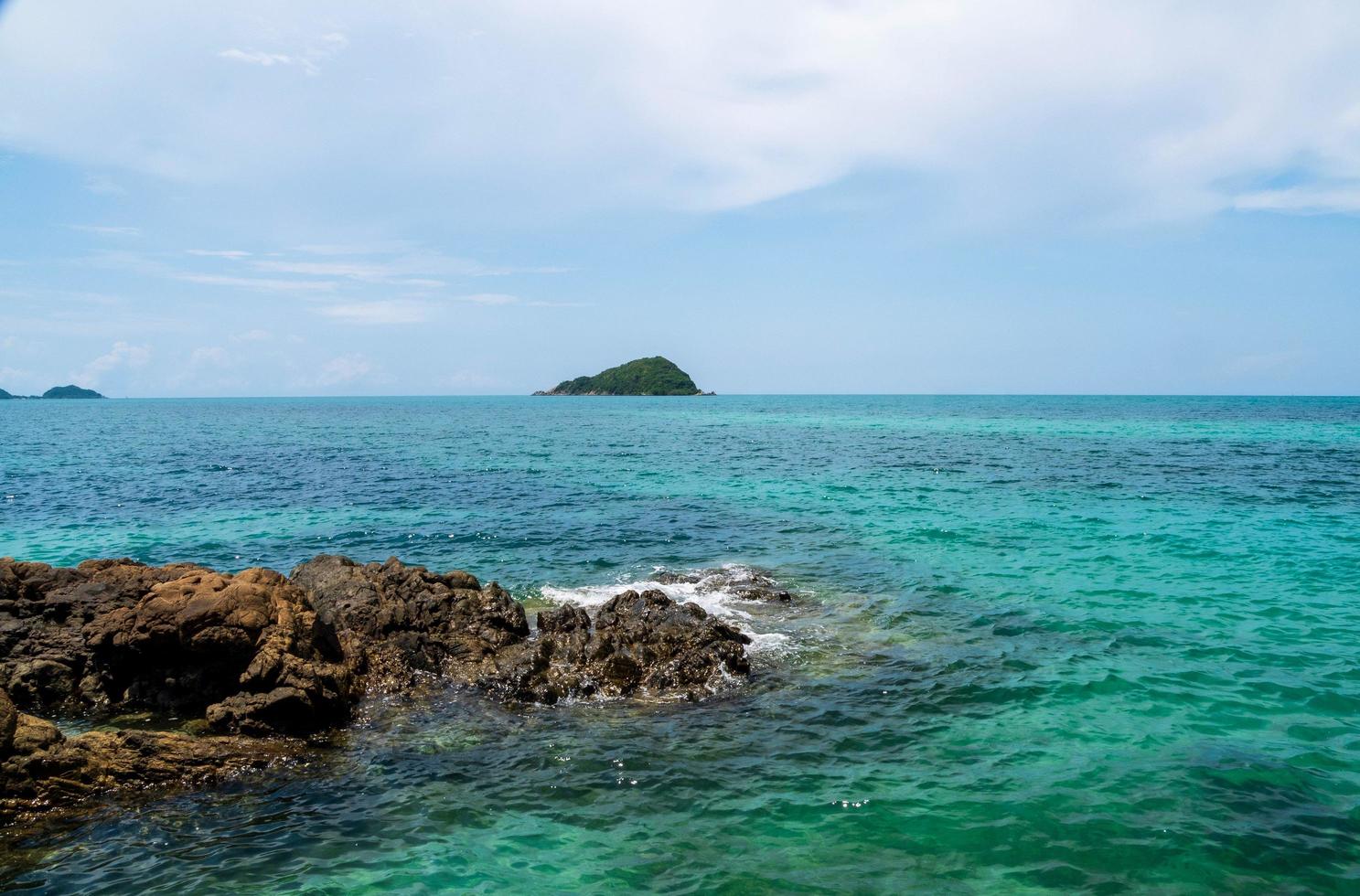 Landscape summer view  tropical sea beach rock blue sky white sand background calm Nature ocean Beautiful wave crash splashing water travel Nang Ram Beach East thailand Chonburi Exotic horizon. photo