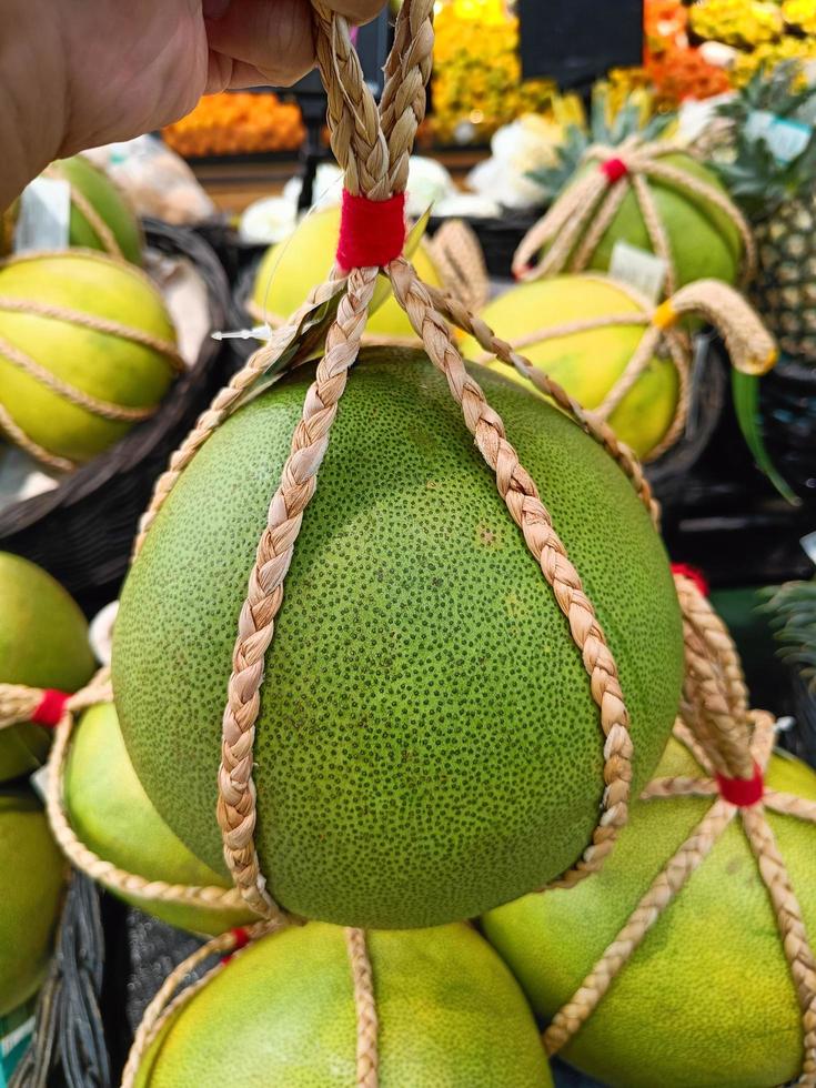 Pomelo or Grapefruit for sale in the supermarket photo