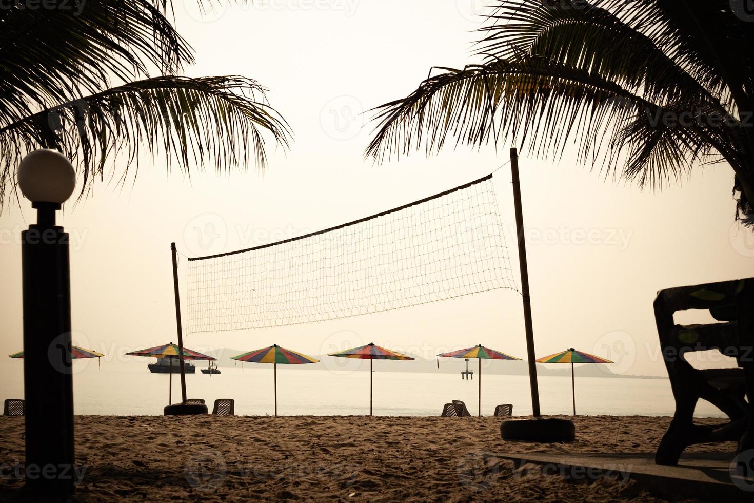 Silhouette of a volleyball net on the beach photo